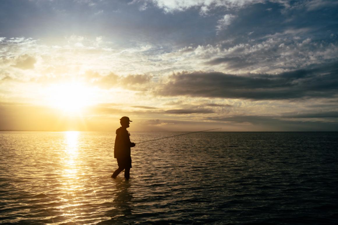 wadefisherman at sunset